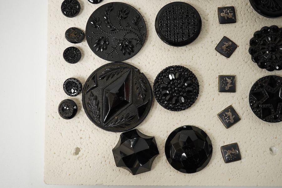 A collection of assorted Victorian and later jet, simulated jet and other decorative buttons, largest 50mm. Condition - good